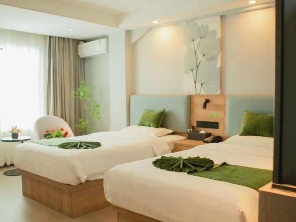 Bed in GreenTree Inn Express Hainan Haikou Haixiu Zhong Road