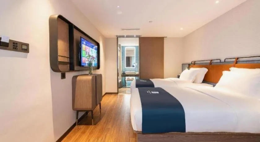Bed in Echarm Hotel Guangzhou Tiyu West Raod Metro Station