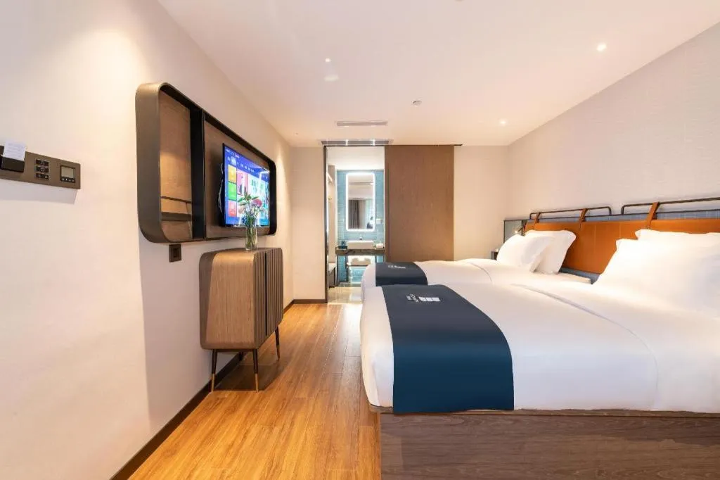 Bed in Echarm Hotel Guangzhou Tiyu West Raod Metro Station