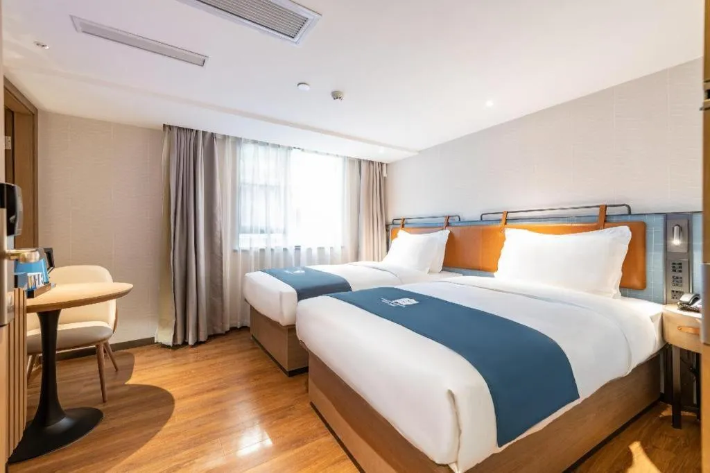 Bed in Echarm Hotel Guangzhou Tiyu West Raod Metro Station