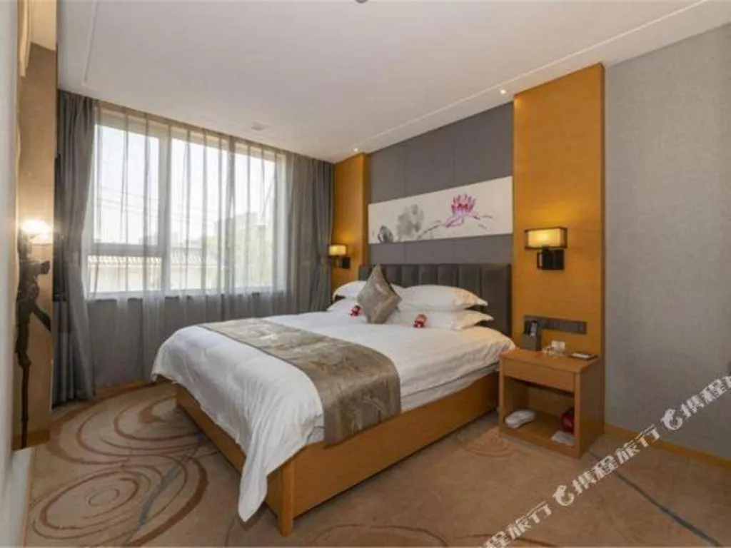 Bed in Borrman Hotel Jinan Yijia Exhibition Center Laotun Metro Station