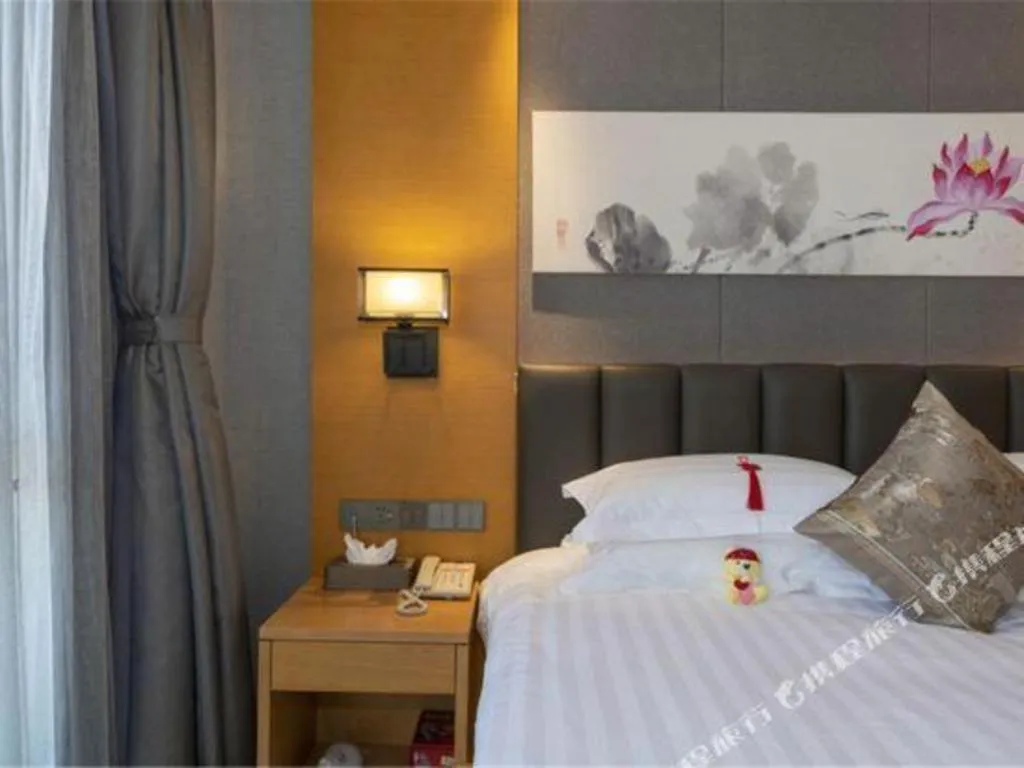 Bed in Borrman Hotel Jinan Yijia Exhibition Center Laotun Metro Station