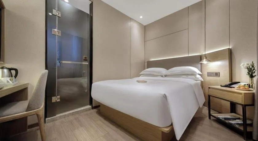 Bed in Echarm Hotel Guangzhou Gangding Huashi Metro Station
