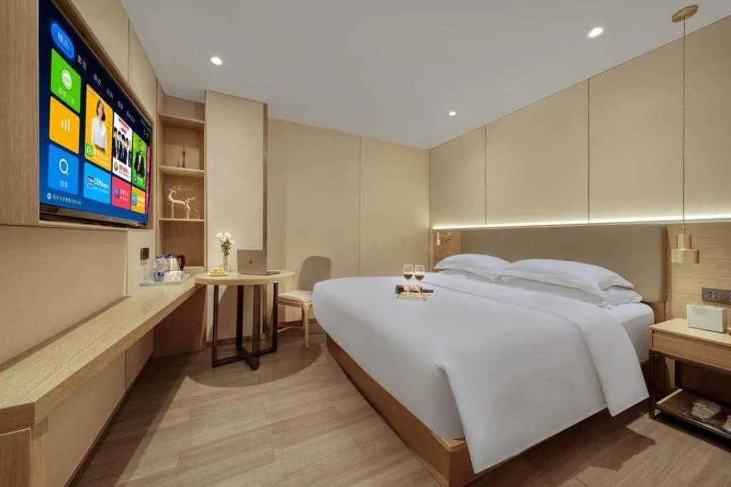 Bed in Echarm Hotel Guangzhou Gangding Huashi Metro Station