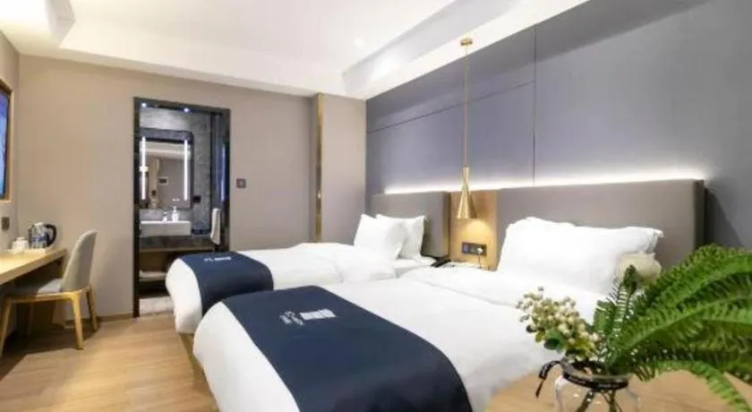 Bed in Echarm Hotel Guangzhou Gangding Huashi Metro Station