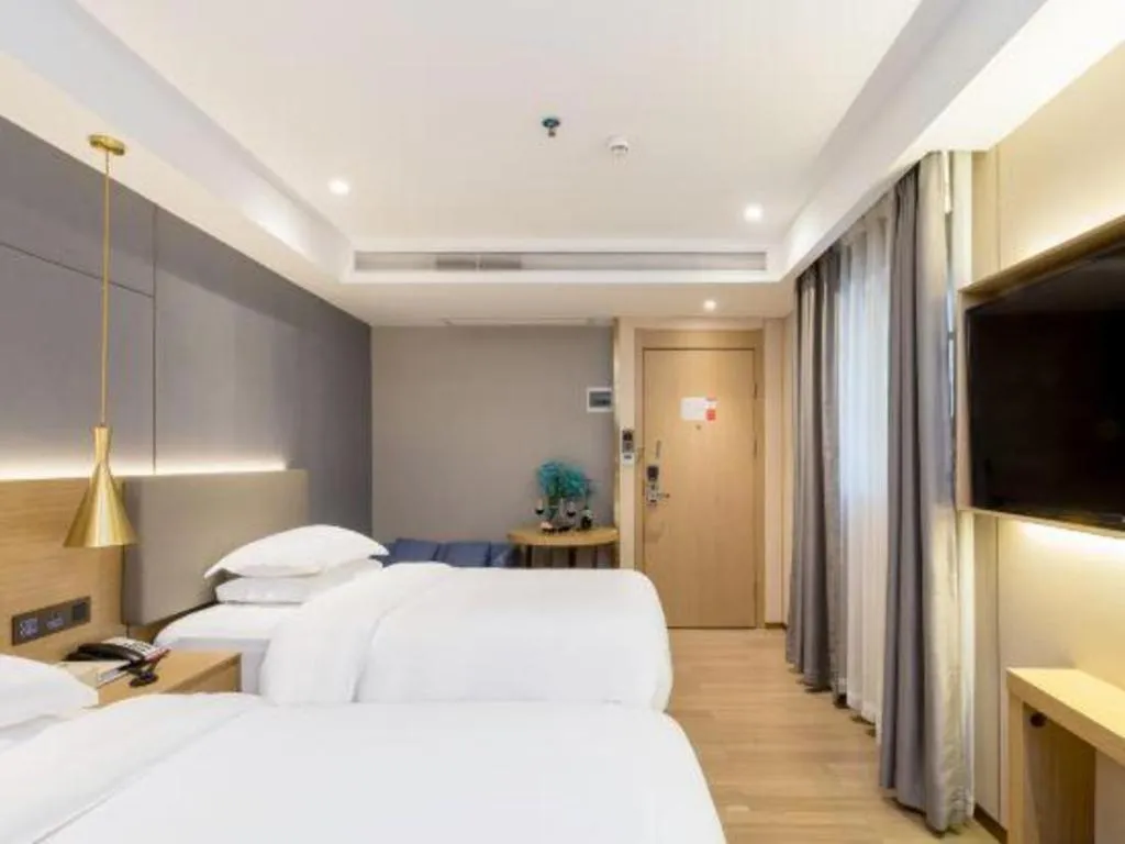 Bed in Echarm Hotel Guangzhou Gangding Huashi Metro Station