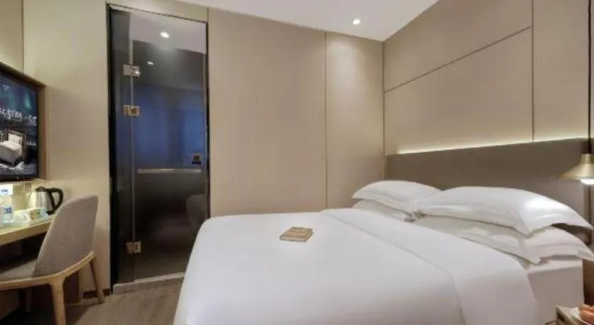 Bed in Echarm Hotel Guangzhou Gangding Huashi Metro Station