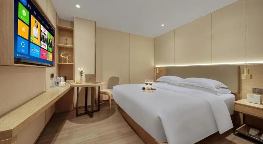 Bed in Echarm Hotel Guangzhou Gangding Huashi Metro Station