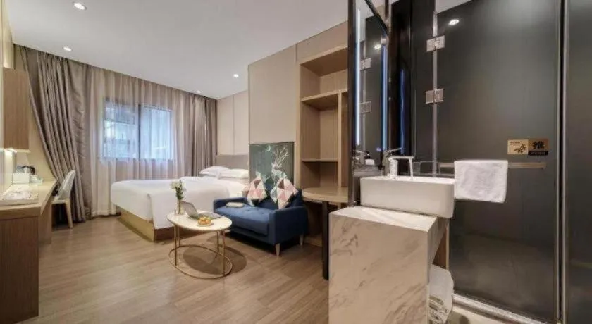 Bed in Echarm Hotel Guangzhou Gangding Huashi Metro Station