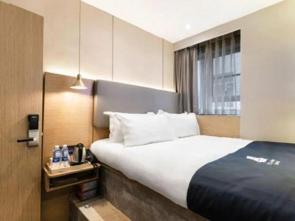 Bed in Echarm Hotel Guangzhou Gangding Huashi Metro Station