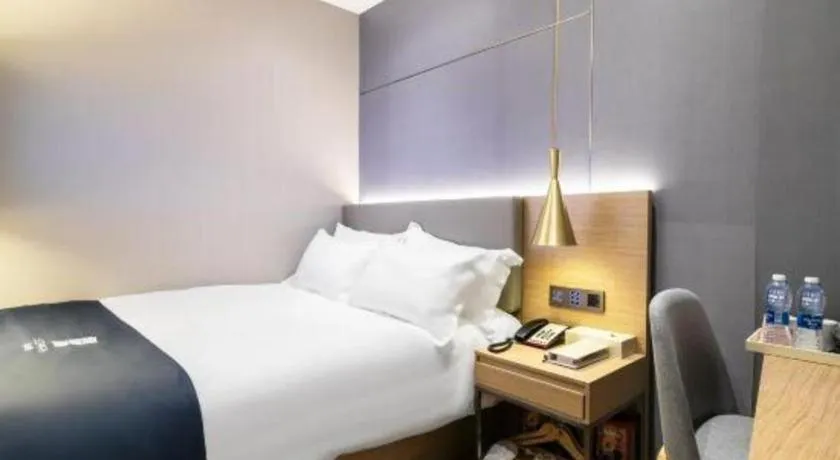 Bed in Echarm Hotel Guangzhou Gangding Huashi Metro Station