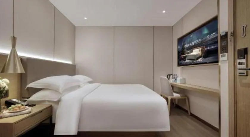 Bed in Echarm Hotel Guangzhou Gangding Huashi Metro Station