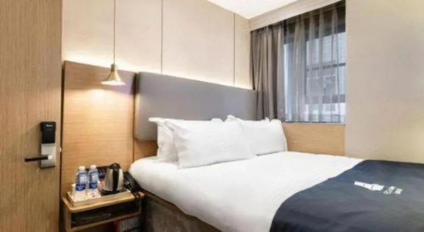 Bed in Echarm Hotel Guangzhou Gangding Huashi Metro Station