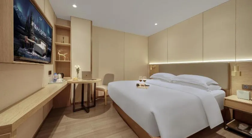 Bed in Echarm Hotel Guangzhou Gangding Huashi Metro Station