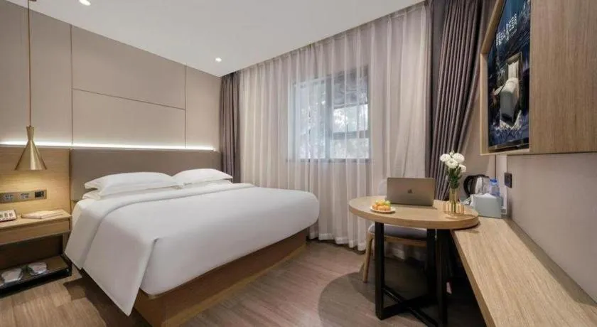 Bed in Echarm Hotel Guangzhou Gangding Huashi Metro Station