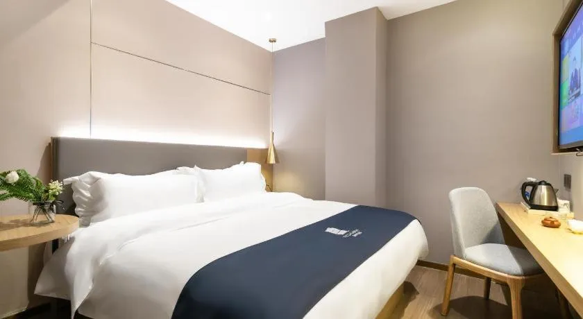 Bed in Echarm Hotel Guangzhou Gangding Huashi Metro Station