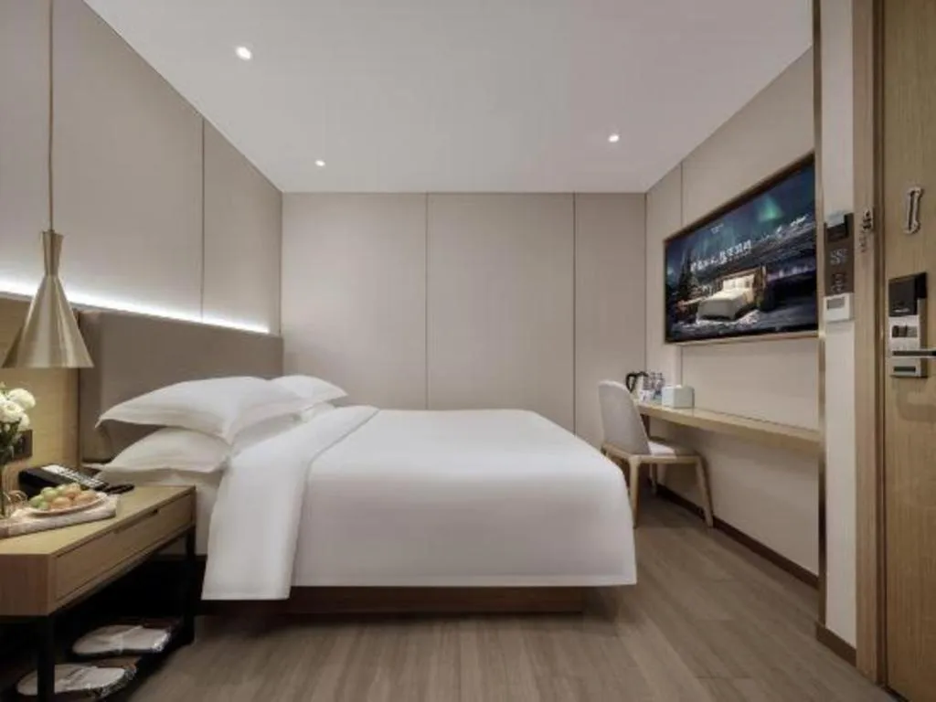 Bed in Echarm Hotel Guangzhou Gangding Huashi Metro Station