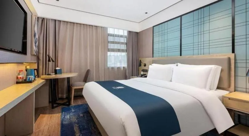 Bed in Echarm Hotel Shenzhen International Exhibition Center Fuyong