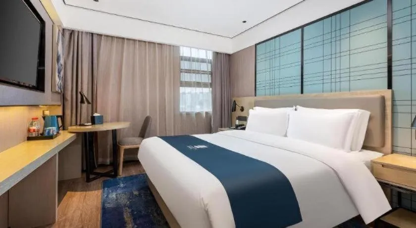 Bed in Echarm Hotel Shenzhen International Exhibition Center Fuyong