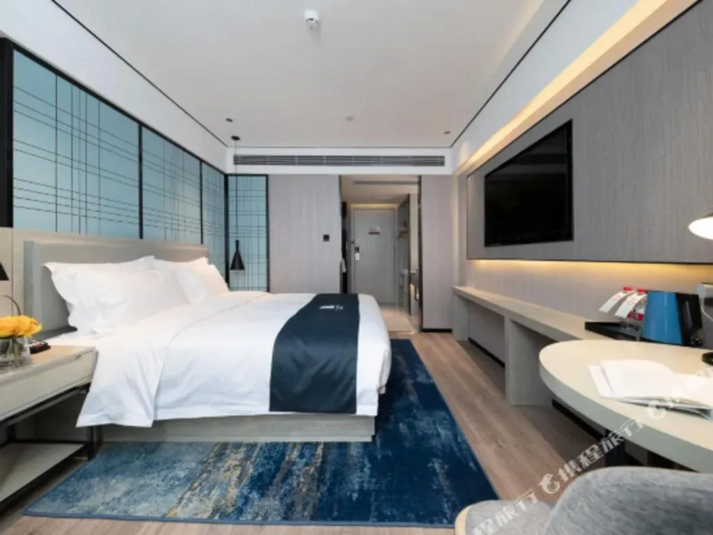 Bed in Echarm Hotel Shenzhen International Exhibition Center Fuyong