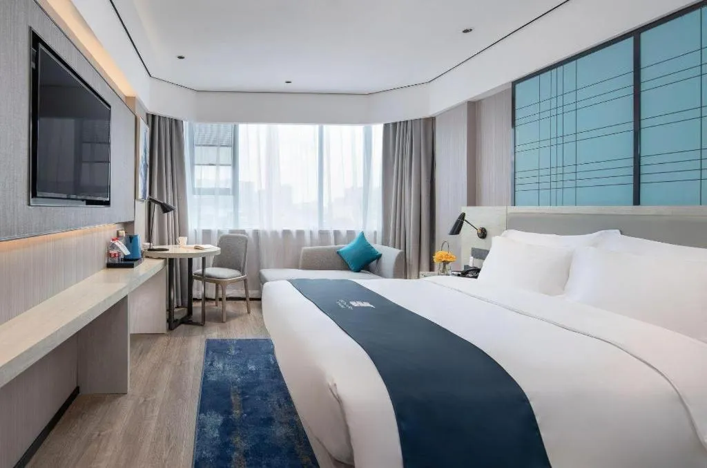 Bed in Echarm Hotel Shenzhen International Exhibition Center Fuyong