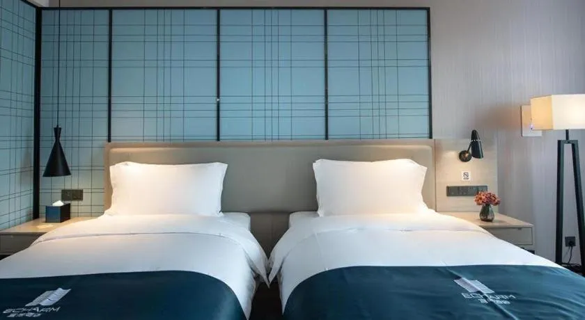 Bed in Echarm Hotel Shenzhen International Exhibition Center Fuyong
