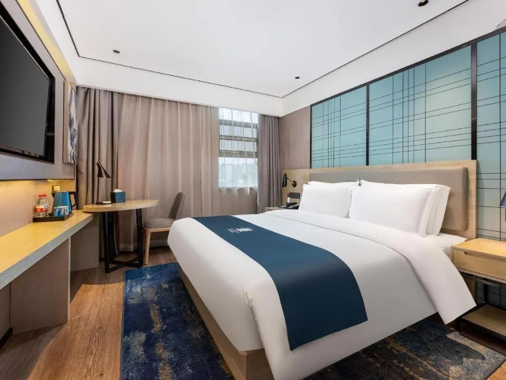 Bed in Echarm Hotel Shenzhen International Exhibition Center Fuyong