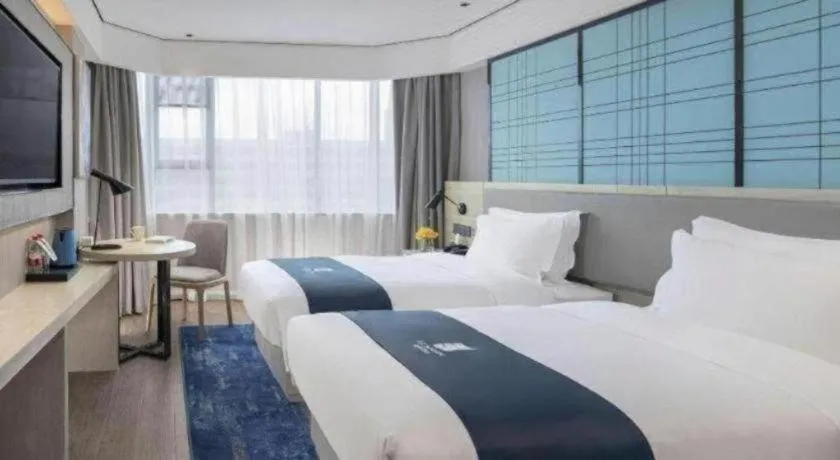 Bed in Echarm Hotel Shenzhen International Exhibition Center Fuyong