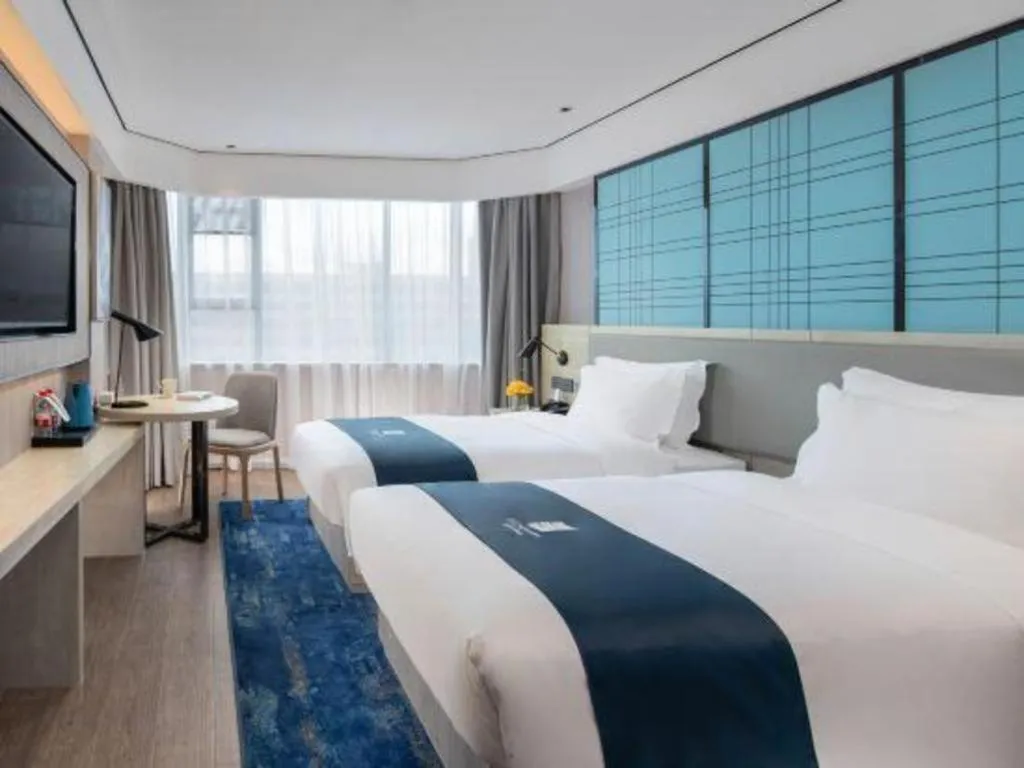 Bed in Echarm Hotel Shenzhen International Exhibition Center Fuyong