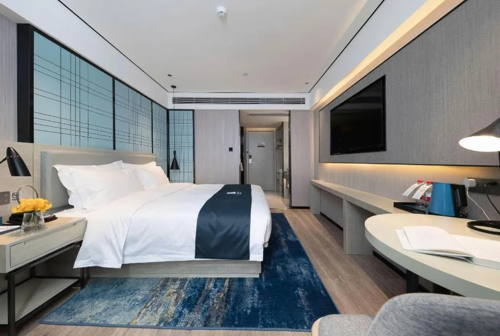 Bed in Echarm Hotel Shenzhen International Exhibition Center Fuyong