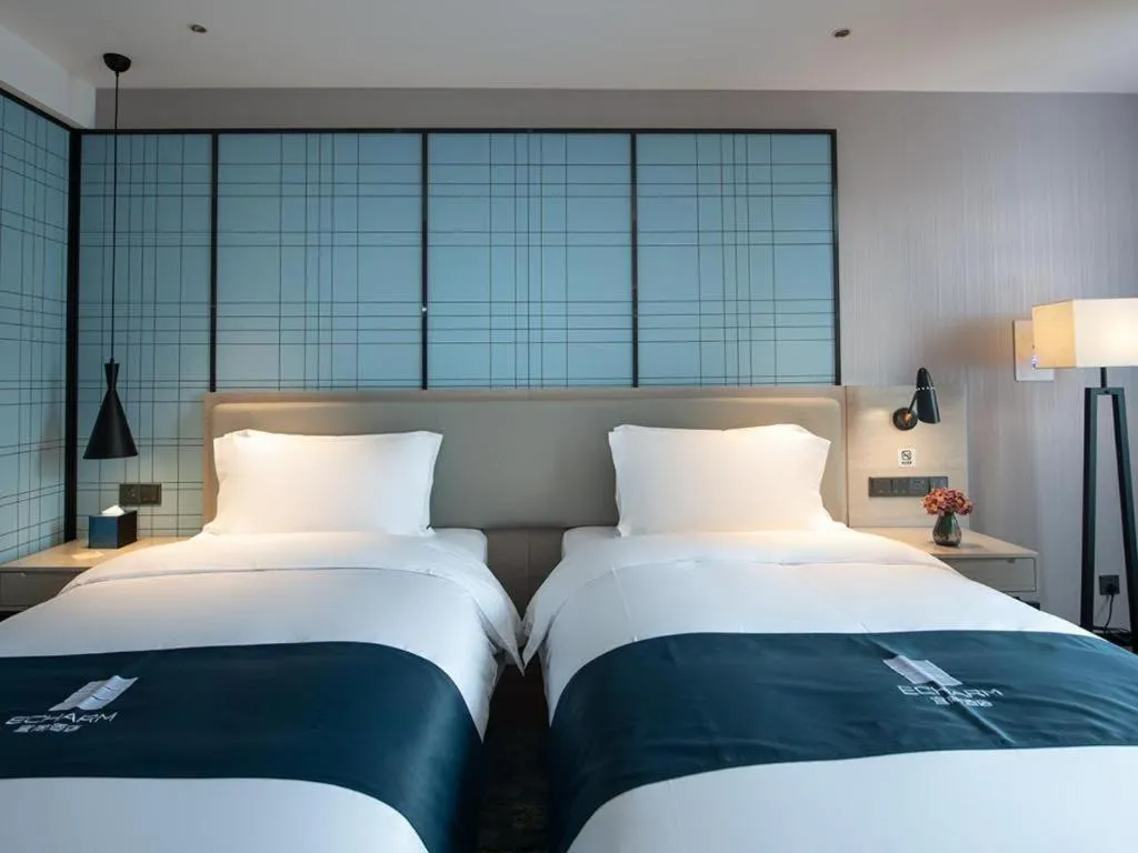 Bed in Echarm Hotel Shenzhen International Exhibition Center Fuyong