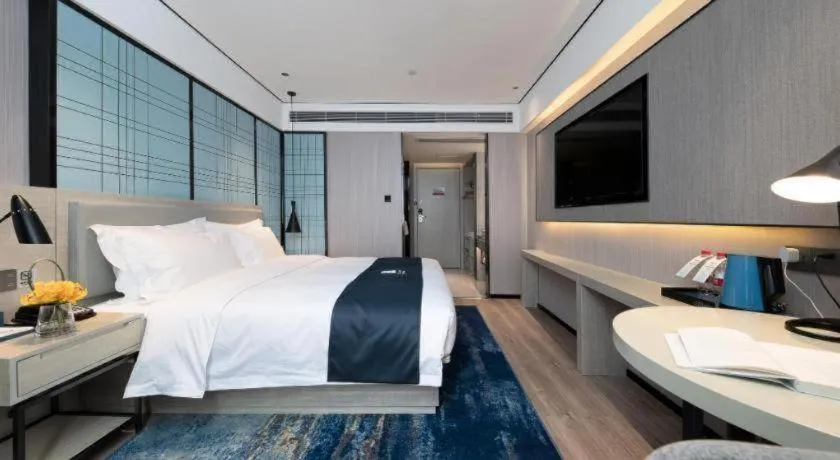 Bed in Echarm Hotel Shenzhen International Exhibition Center Fuyong