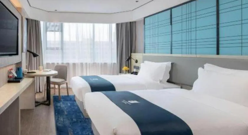 Bed in Echarm Hotel Shenzhen International Exhibition Center Fuyong
