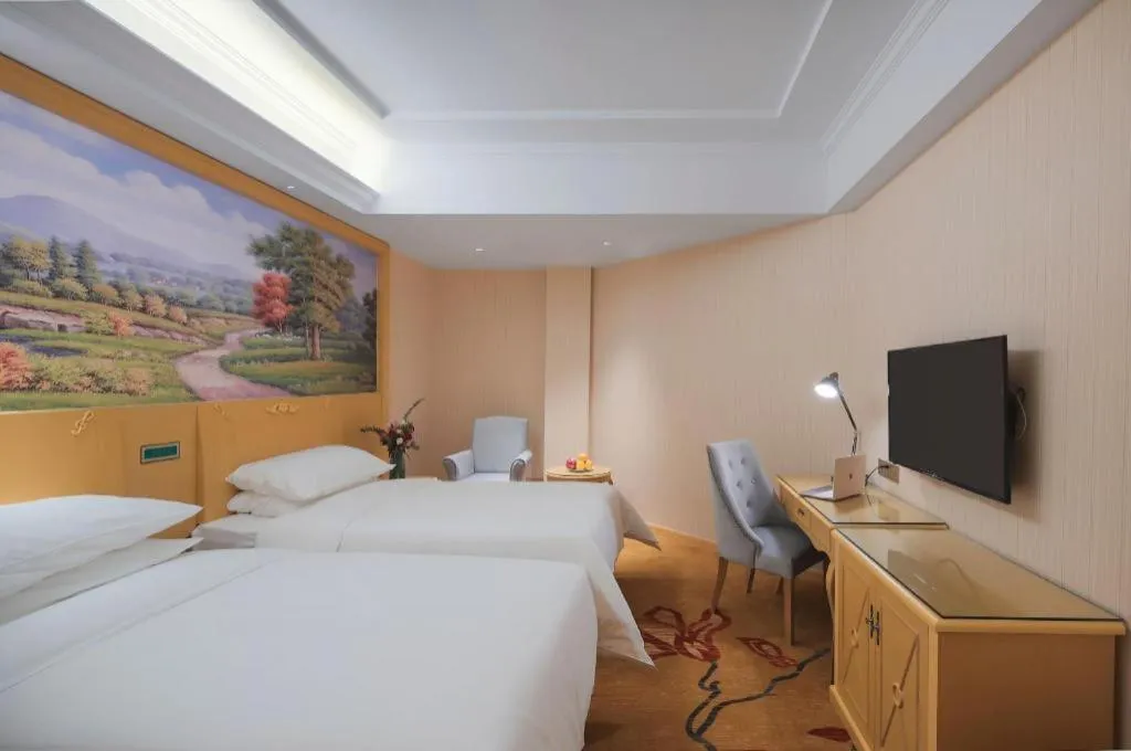 Bed in Vienna Hotel Hangzhou Jiubao Sijiqing Suanli Town