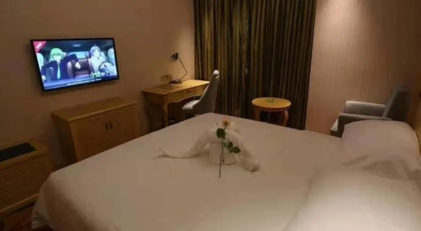 Bed in Vienna Hotel Hangzhou Jiubao Sijiqing Suanli Town