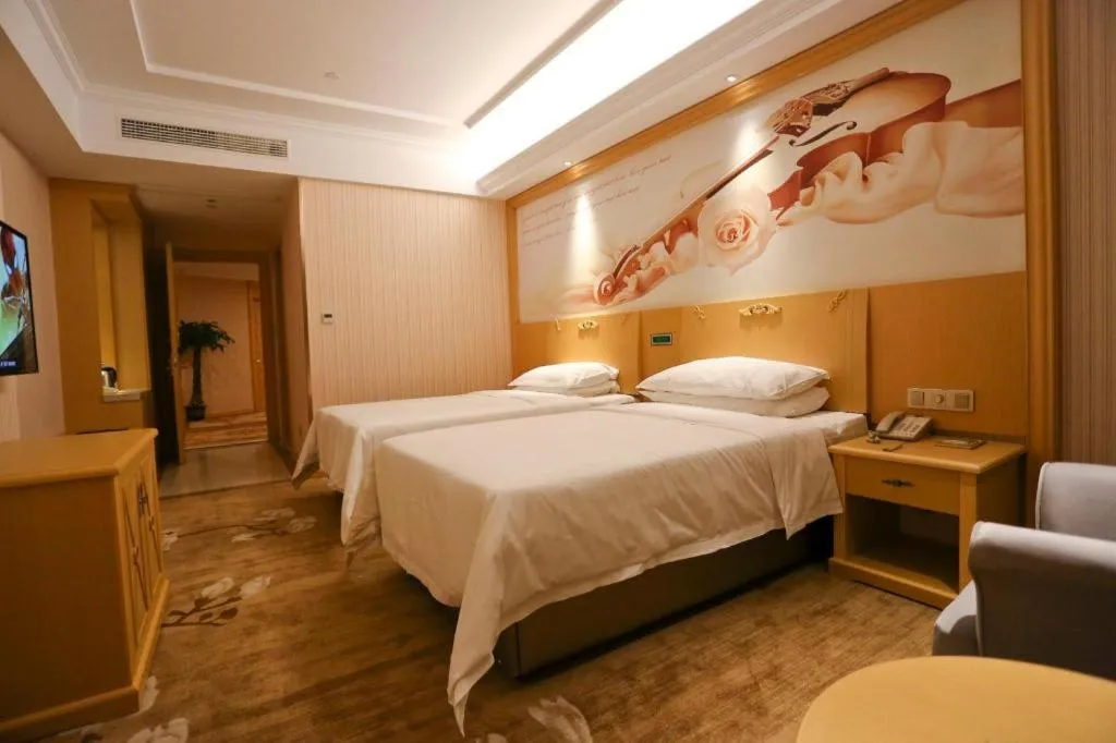 Bed in Vienna Hotel Hangzhou Jiubao Sijiqing Suanli Town