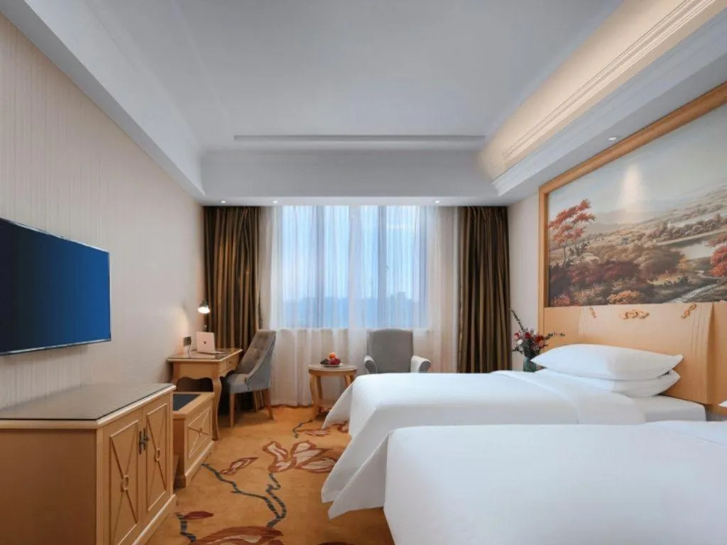 Bed in Vienna Hotel Hangzhou Jiubao Sijiqing Suanli Town