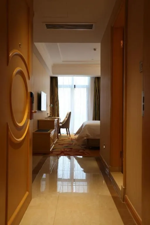 Bed in Vienna Hotel Hangzhou Jiubao Sijiqing Suanli Town