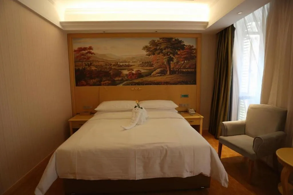 Bed in Vienna Hotel Hangzhou Jiubao Sijiqing Suanli Town