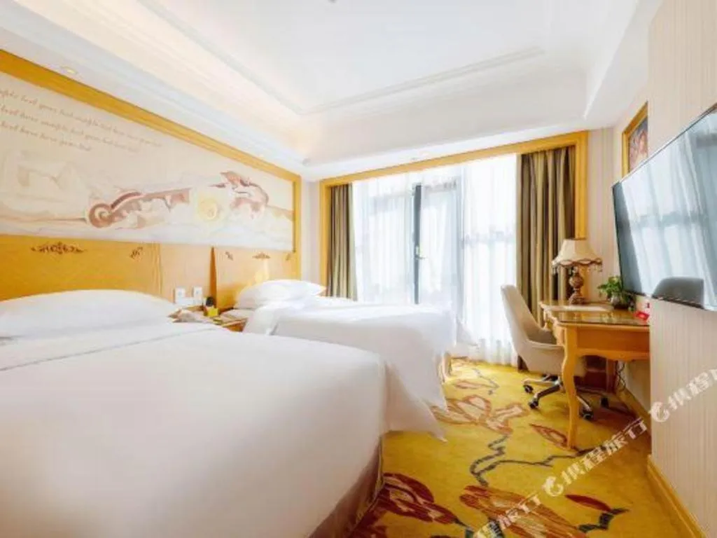 Bed in Vienna Hotel Shenzhen Qinghu Metro Station