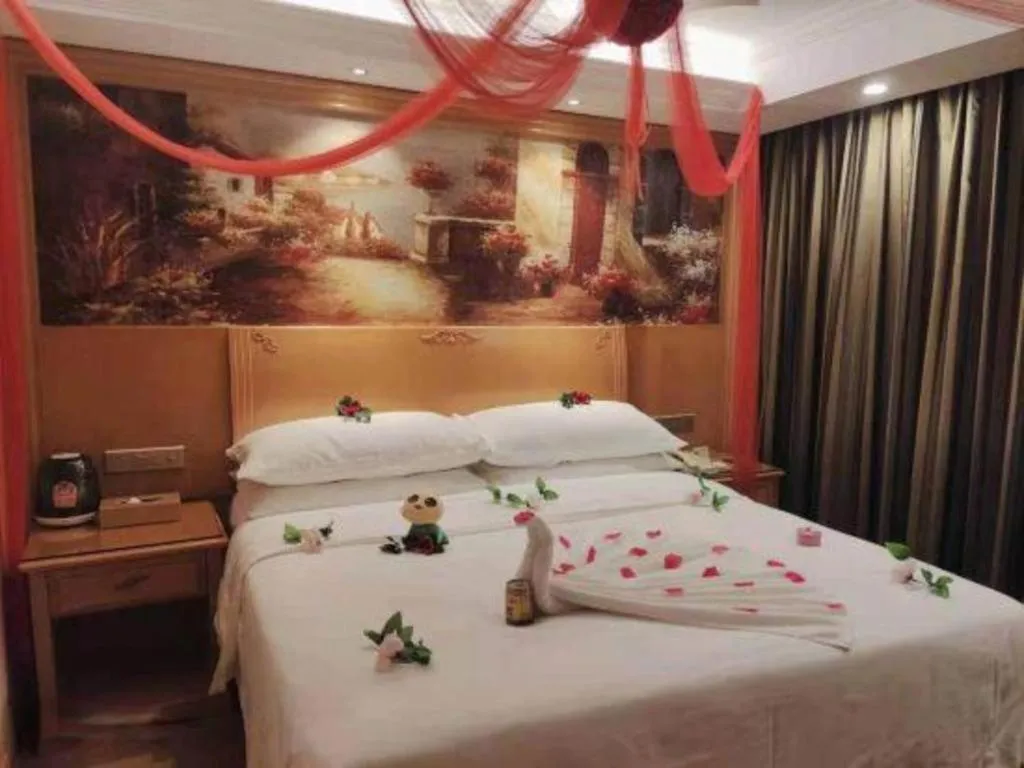 Bed in Vienna Hotel Shenzhen Guanlan Shanshuitianyuan Xintian