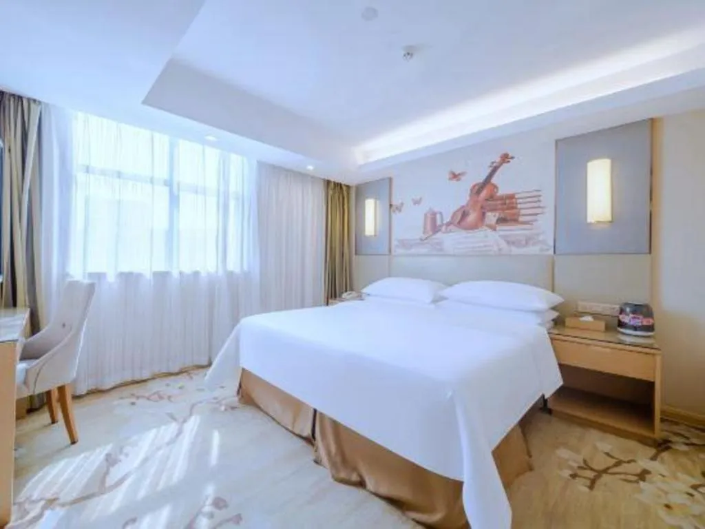 Bed in Vienna Hotel Shenzhen Guanlan Shanshuitianyuan Xintian
