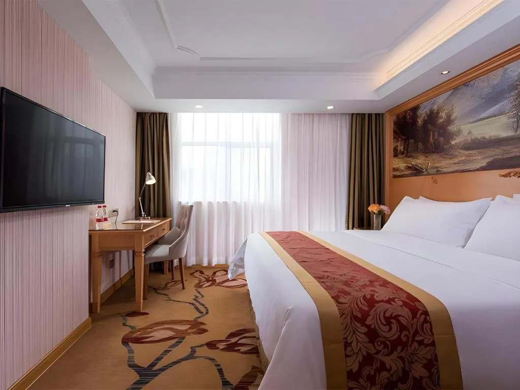 Bed in Vienna Hotel Shenzhen Guanlan Shanshuitianyuan Xintian