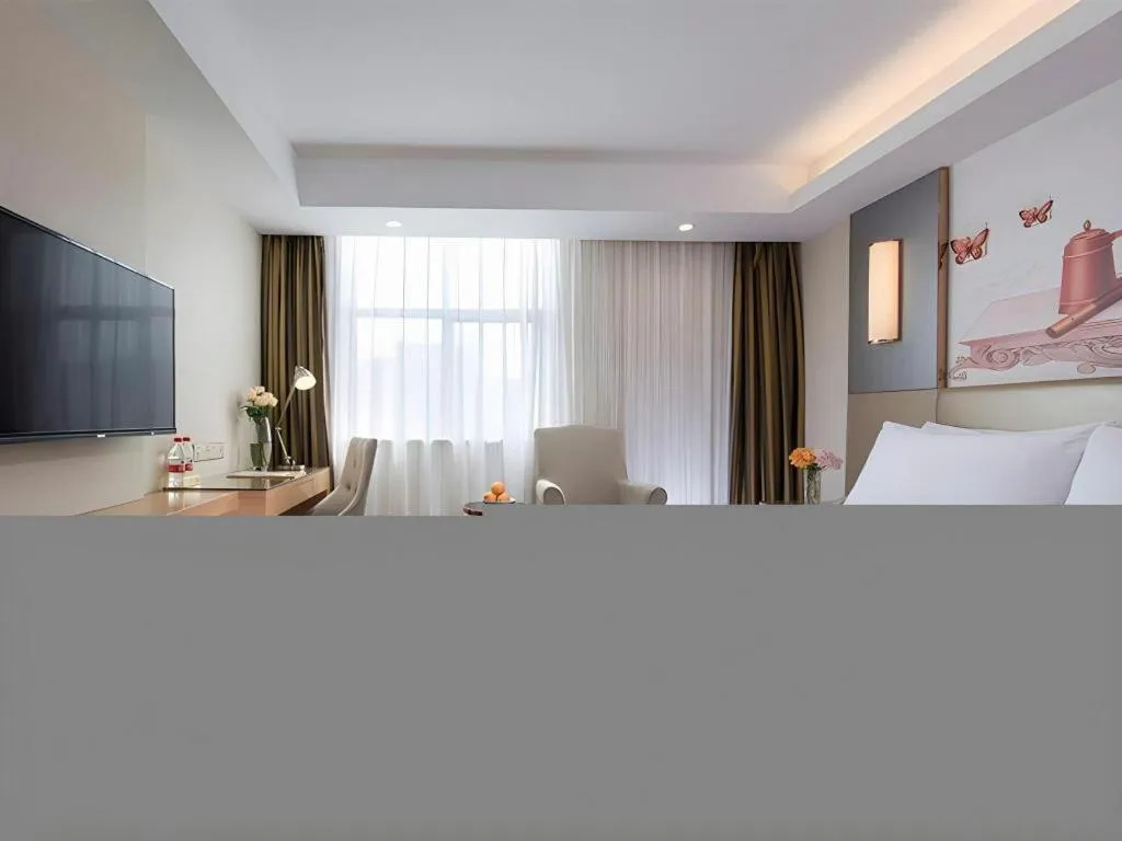 Bed in Vienna Hotel Shenzhen Guanlan Shanshuitianyuan Xintian