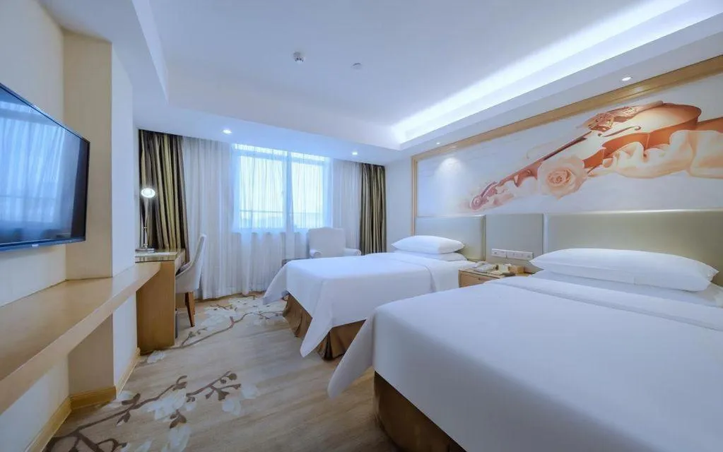 Bed in Vienna Hotel Shenzhen Guanlan Shanshuitianyuan Xintian