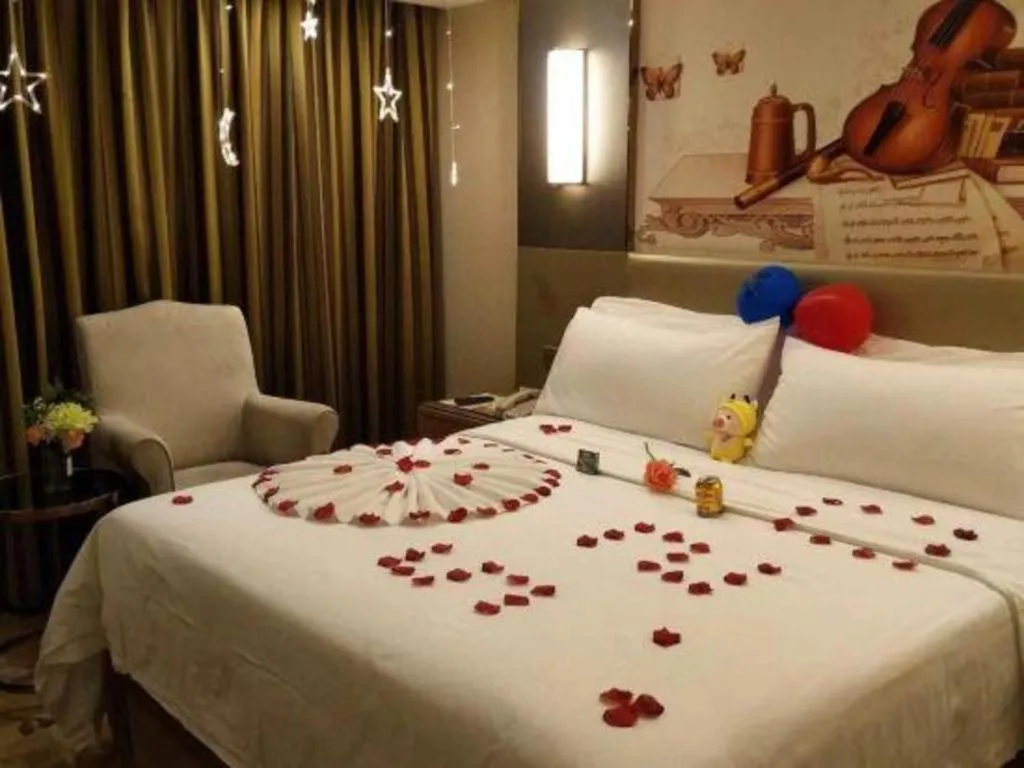 Bed in Vienna Hotel Shenzhen Guanlan Shanshuitianyuan Xintian