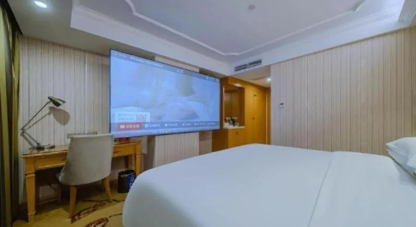 Bed in Vienna Hotel Shenzhen Guanlan Shanshuitianyuan Xintian