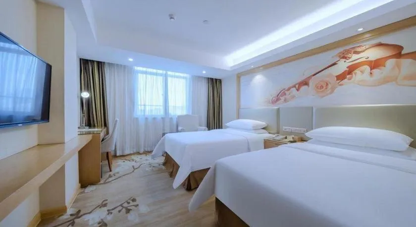 Bed in Vienna Hotel Shenzhen Guanlan Shanshuitianyuan Xintian