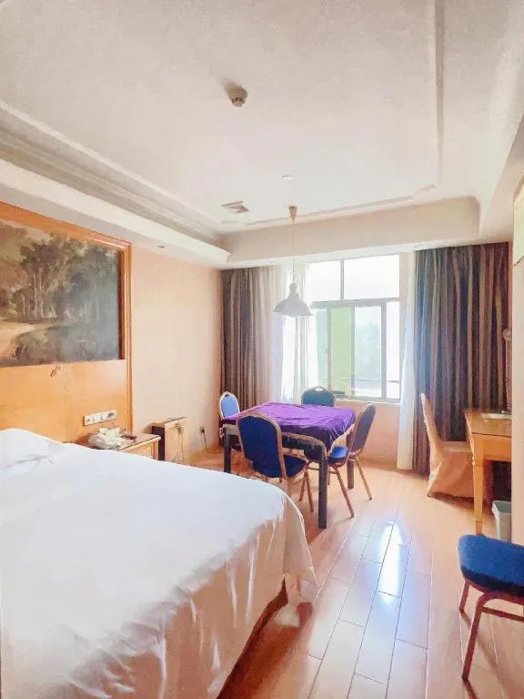 Bed in Vienna Hotel Shenzhen Guanlan Shanshuitianyuan Xintian
