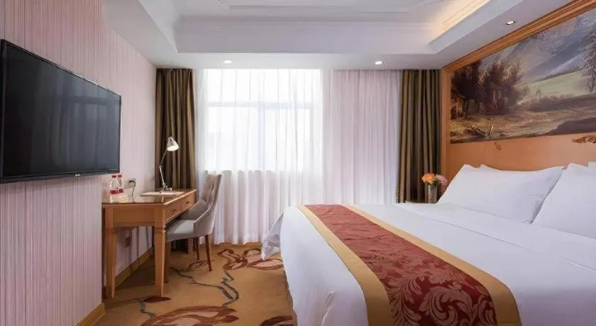Bed in Vienna Hotel Shenzhen Guanlan Shanshuitianyuan Xintian